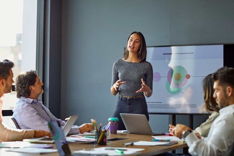 Photo of woman facilitating a meeting